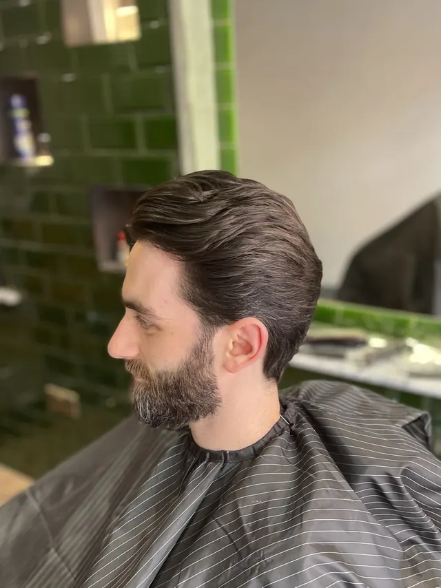 A side part and beard at Bank